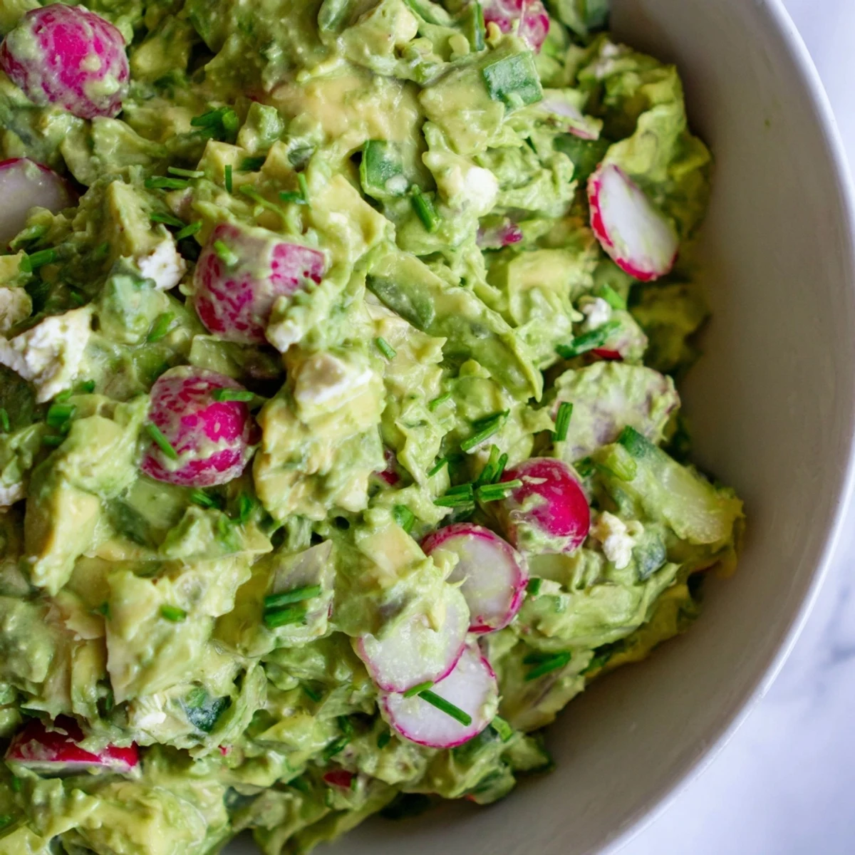 Imagine a close-up of the delicious Green Goddess Cabbage Dip, brimming with colorful chopped vegetables.