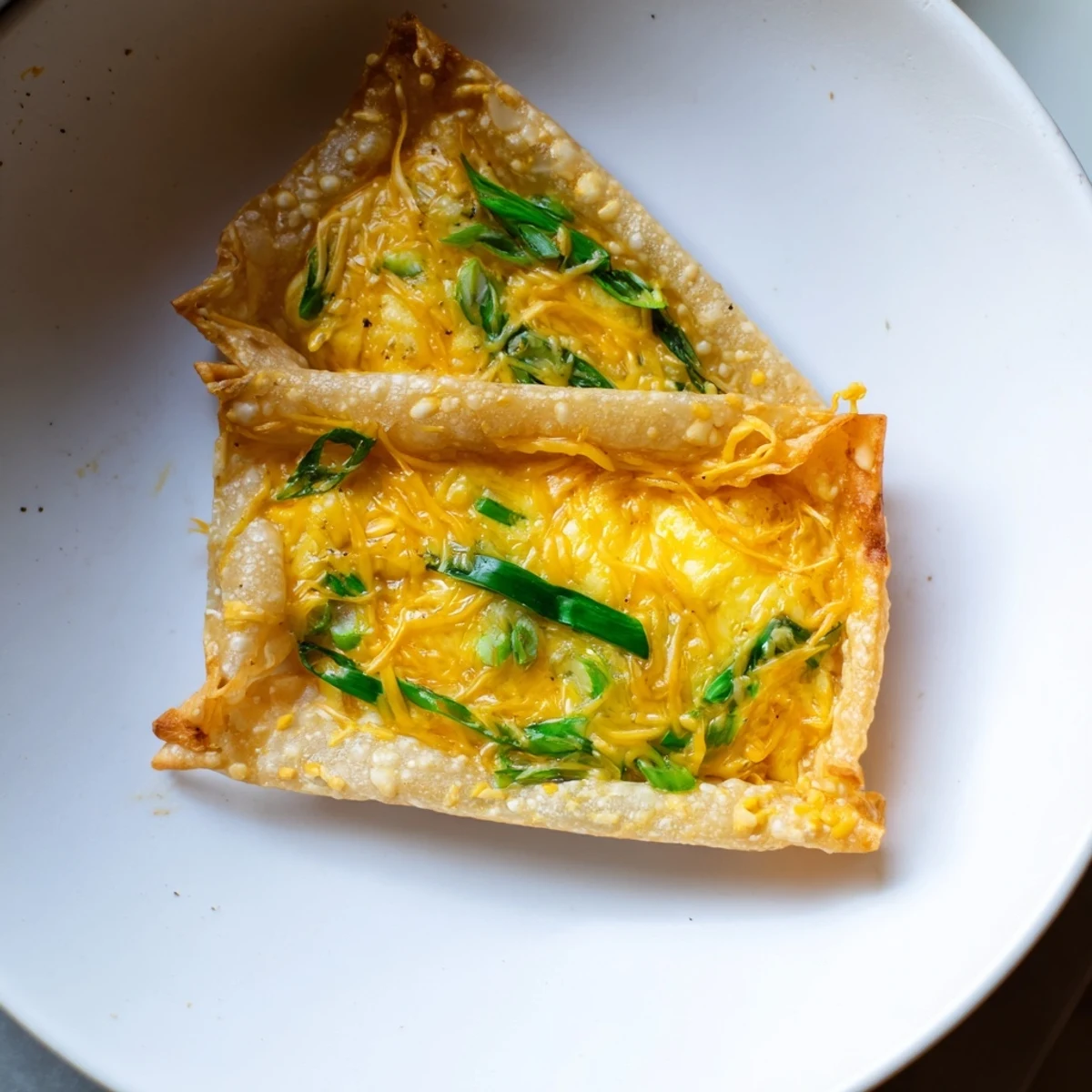 Warm, crispy Rice Paper Egg & Cheese Fold with golden edges and melty cheese, perfect quick breakfast.