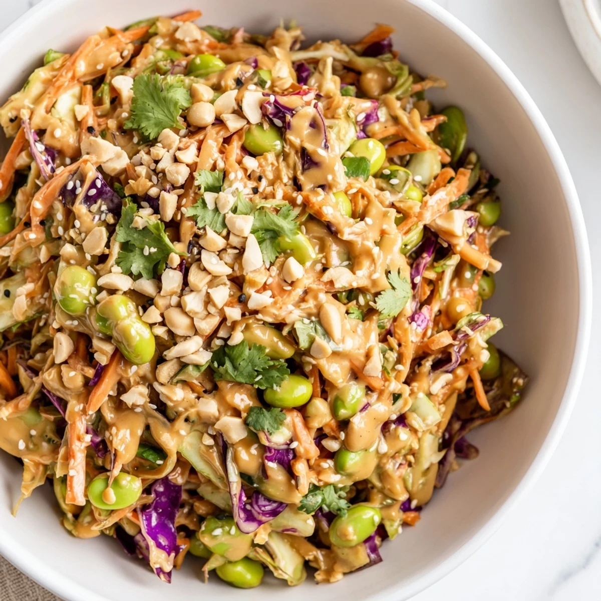 Colorful vegetables and roasted peanuts make this Thai Peanut Salad a refreshing, tangy side dish, perfect for potlucks or a light vegetarian meal.