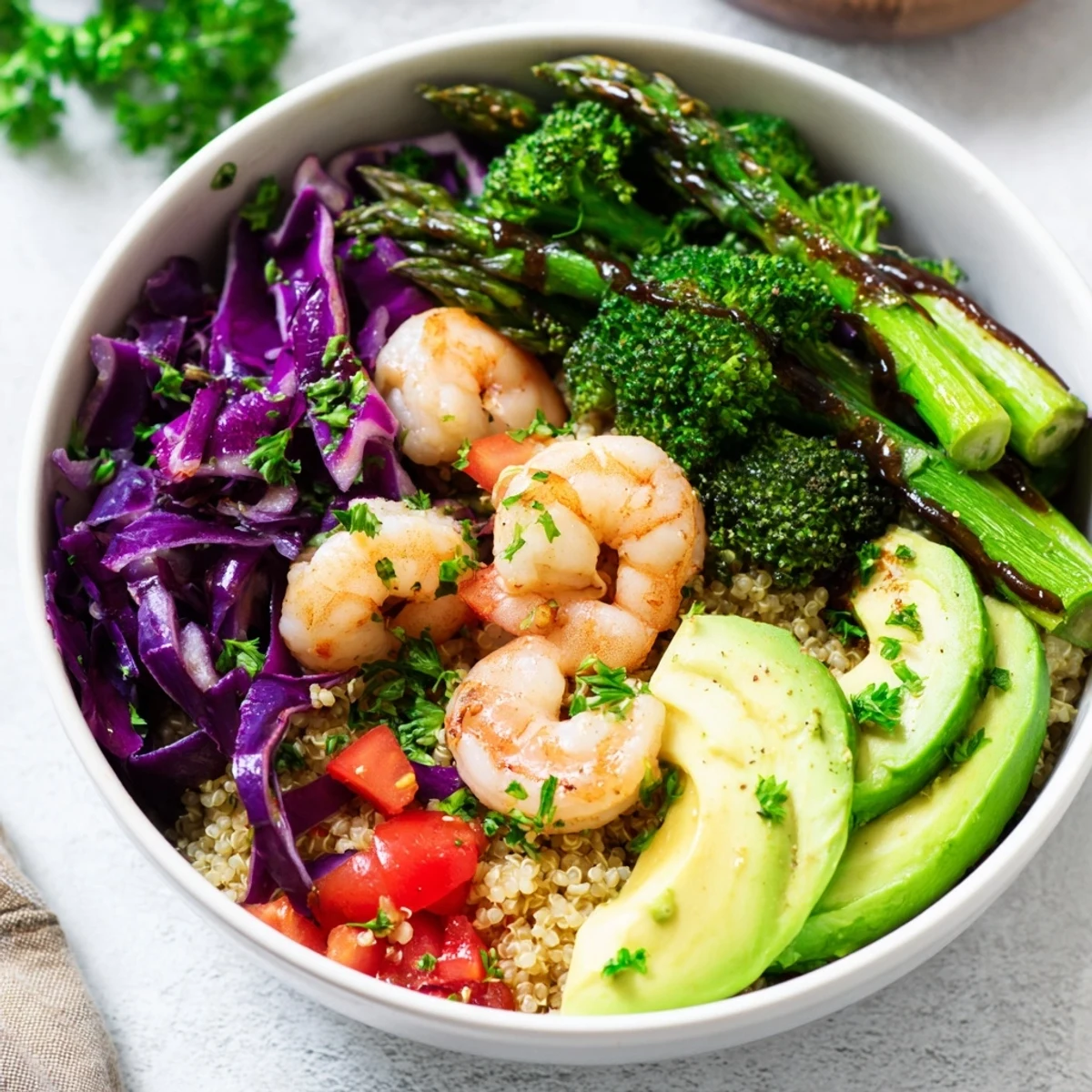 A vibrant Detox Buddha Bowl with Shrimp and Quinoa, featuring roasted broccoli, asparagus, and creamy avocado on fluffy quinoa.
