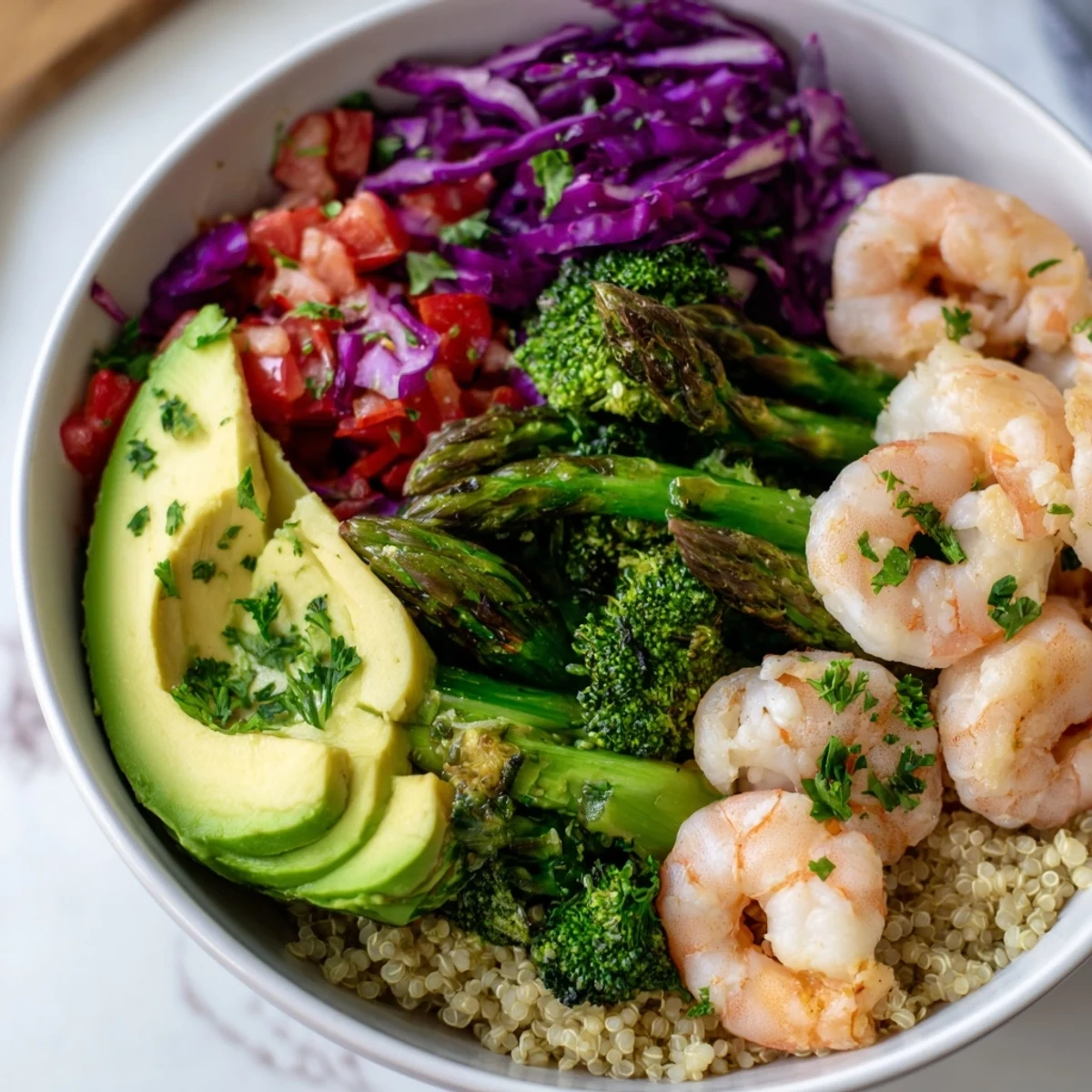 Healthy Detox Buddha Bowl with Shrimp and Quinoa served with lemon wedges and herbs, perfect for a light, nutritious meal.
