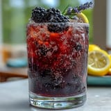 Sparkling Blackberry Lavender Lemonade Fizz, bursting with floral summer flavors.