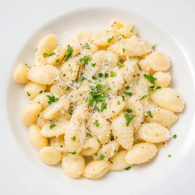 Creamy one-pot garlic butter ditalini pasta, ready to serve with fresh parsley for a comforting dinner.