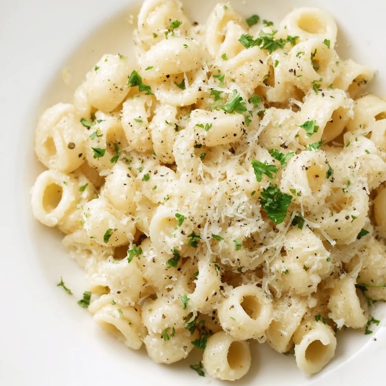Close-up of perfectly cooked one-pot garlic butter ditalini: a flavorful and simple Italian-American dish.
